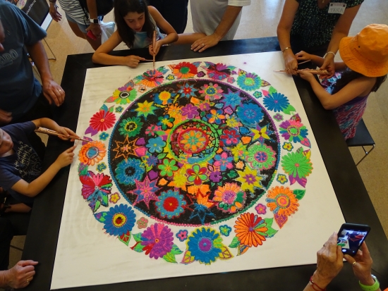 Putting the final touches on the Community Sand Painting: Third Edition