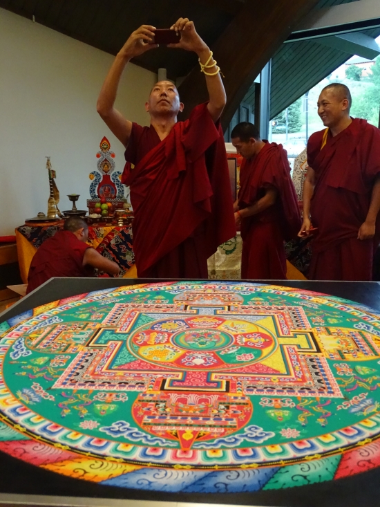 21st century monks: Just like us, they save pics of their mandala too.