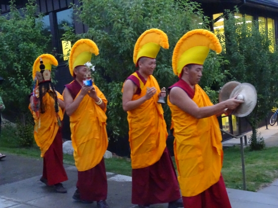 The Green Tara mandala is paraded down 13th Street, along the edge of the library and toward the river.