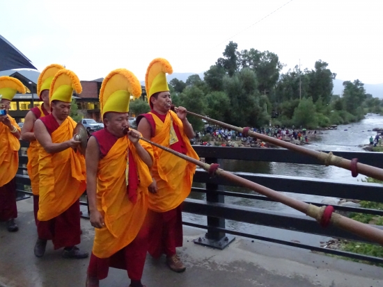 Tibetan horns announce the mandala's crossing over the Yampa River's 13th Street bridge.