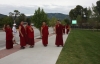 The Drepung Loseling monks cruise Lincoln Avenue with the Steamboat Ski Area in the background during their 2010 residency at the Bud Werner Memorial Library.