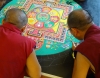 The monks added dozens of tiny items to the mandala today, from bitty snow lions to blossoming lotus flowers.