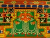 The zimba is the mandala's monster. He is a fantastical creature that is a cross between a lion and a crocodile. Holding his jewels, he is a reminder to keep moral consistency and watch your words. Next to him are two thumbnail-sized snow lions, holding up "the pillars."