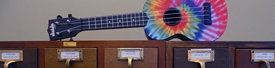 a colorful guitar on a cabinet