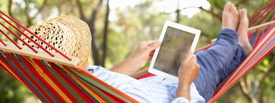 Reading on a tablet while lying in a hammock